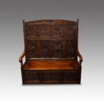 Antique carved oak settle