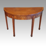 Antique mahogany demi lune tea table