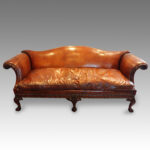 Edwardian camel back leather sofa