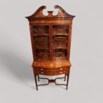 Edwardian inlaid serpentine bookcase