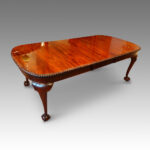 Edwardian mahogany claw and ball extending dining table