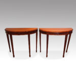 Pair of Edwardian mahogany demi lune console tables