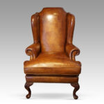 Queen Anne style leather wingchair