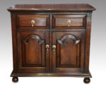 Oak small panelled cupboard
