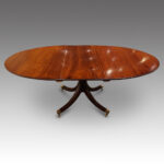 Oval mahogany extending dining table