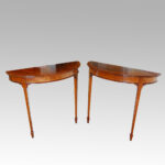 Edwardian mahogany demi lune tables