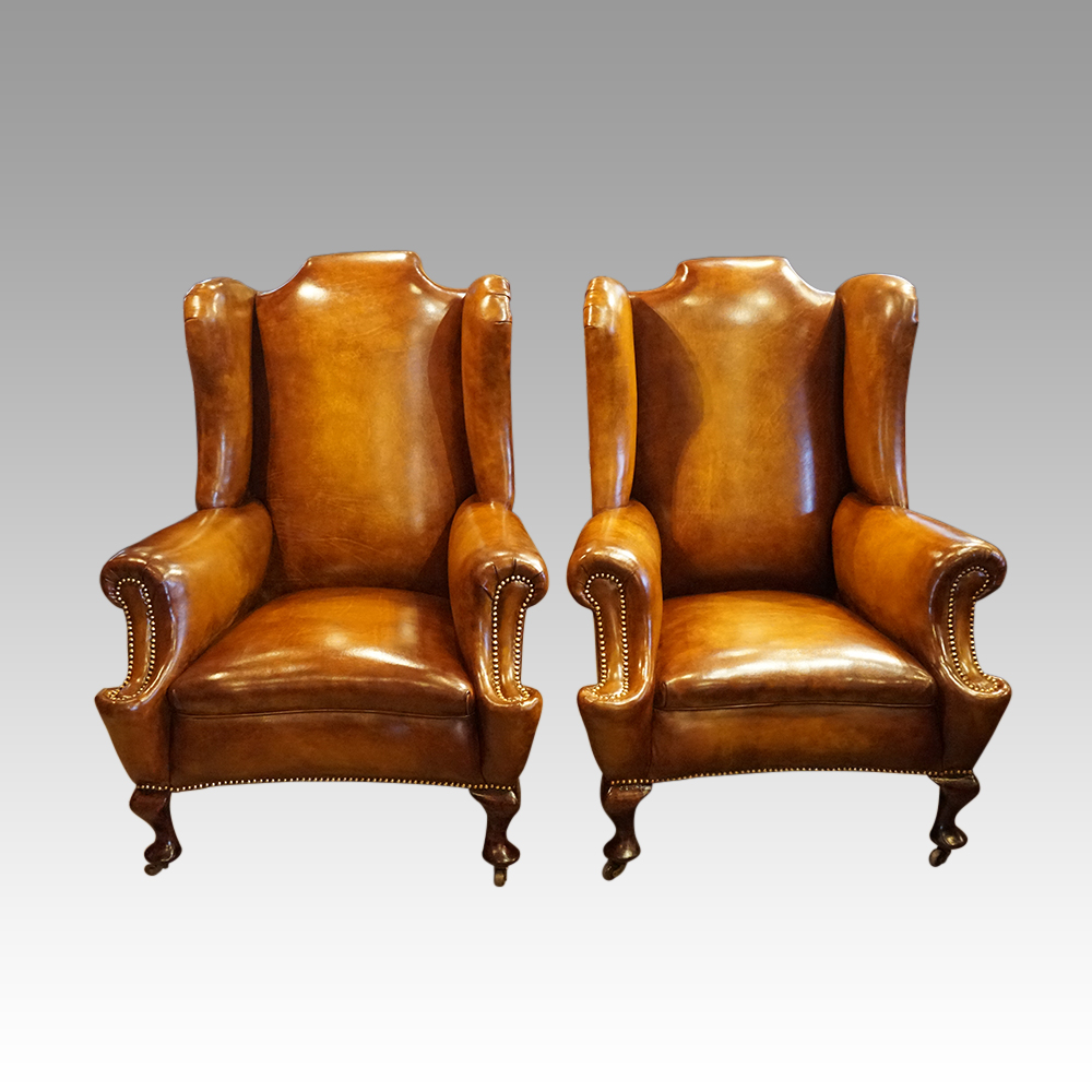 Pair-of-Edwardian-leather-wing-chairs.jpg Pair of Edwardian leather wing chairs - Image 1