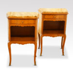 Pair of French walnut and kingwood inlaid marble top bedside cabinets