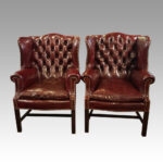 Pair of George VI leather wing chairs