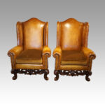 Pair of leather William and Mary style wing chairs