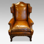 Pair of carved oak and leather wing chairs - Image 2