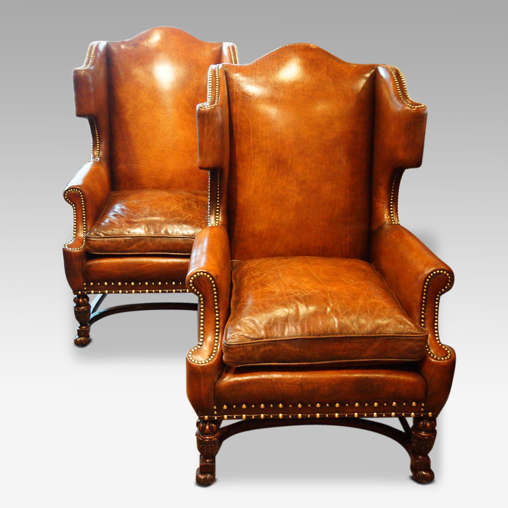 Pair-of-oak-and-leather-wingchairs.jpg Pair of carved oak and leather wing chairs - Image 1