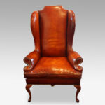 Queen Anne style high-back leather wingchair