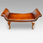 Walnut and leather window seat in the Queen Anne style