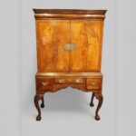 Queen Anne style walnut cabinet on stand