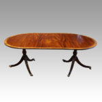Regency style mahogany banded dining table