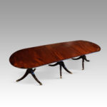 Regency style small triple pillar dining table