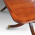 Regency style mahogany cross-banded twin pillar dining table - Image 4