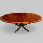 Sheraton style mahogany oval extending dining table