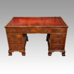 Walnut pedestal desk by Waring and Gillow