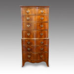 Walnut serpentine tallboy