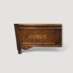 Art Nouveau inlaid oak settle base detail