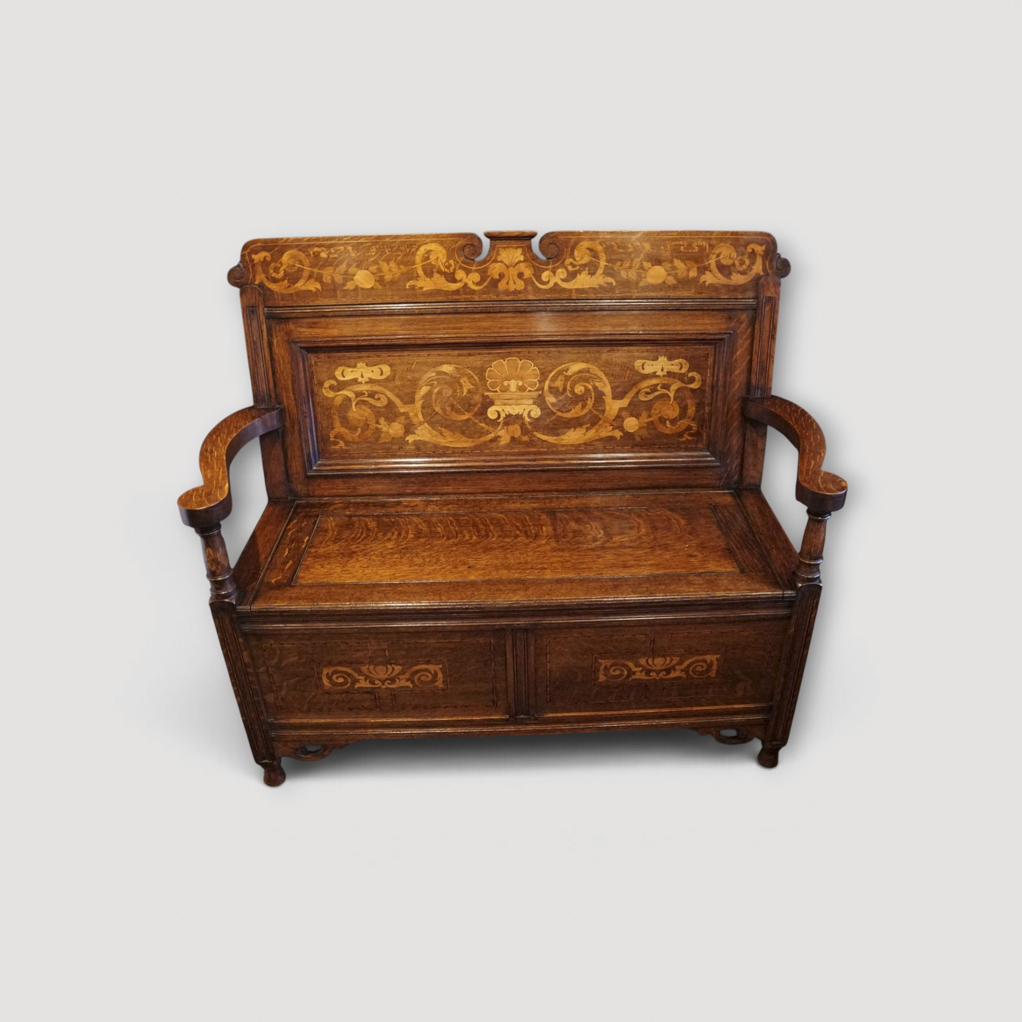 Art Nouveau inlaid oak settle Art Nouveau inlaid oak settle with inlaid floral panels