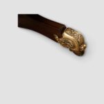 Brown leather Captains chair on brass castors