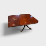 Antique mahogany dining table with twin pedestals