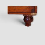 Victorian two‑part campaign chest on turned feet