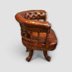 Oak and leather revolving chair from 19th century