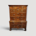 Queen Anne walnut chest‑on‑chest in two parts