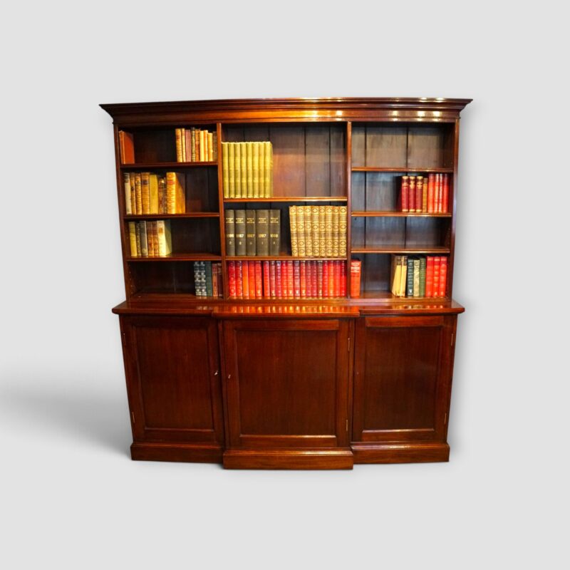 Edwardian mahogany breakfront bookcase with open shelves and cupboards below