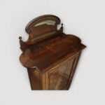 Antique rosewood furniture piece with original mirrored gallery.