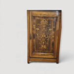Decorative Victorian music cabinet with floral marquetry door panel.