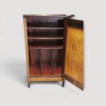 Compact antique rosewood storage cabinet for sheet music and documents.