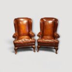 Pair of Queen Anne style leather wing chairs