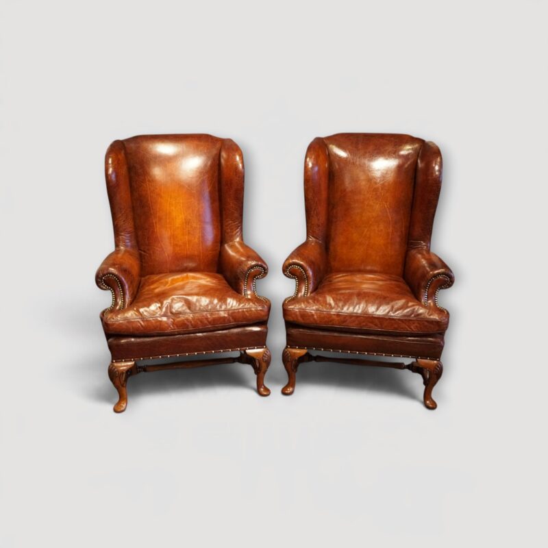 Pair of Queen Anne style leather wing chairs