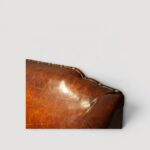 Pair of leather Queen Anne style wing chairs back detail