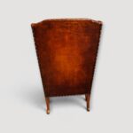 Pair of leather Queen Anne style wing chairs rear