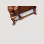 Antique style leather wing chairs with shell carved walnut legs