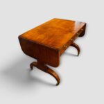 Elegant Regency burr satinwood writing table and sofa table at an angle