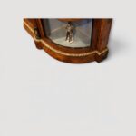 Curved glass display cabinet sections on Victorian walnut credenza.