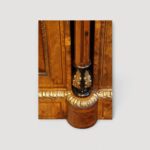 Antique walnut sideboard displaying fine burr walnut grain patterns.